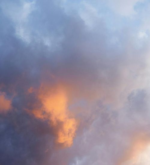 Serene illustration with light clouds and sky blue to white gradient background.